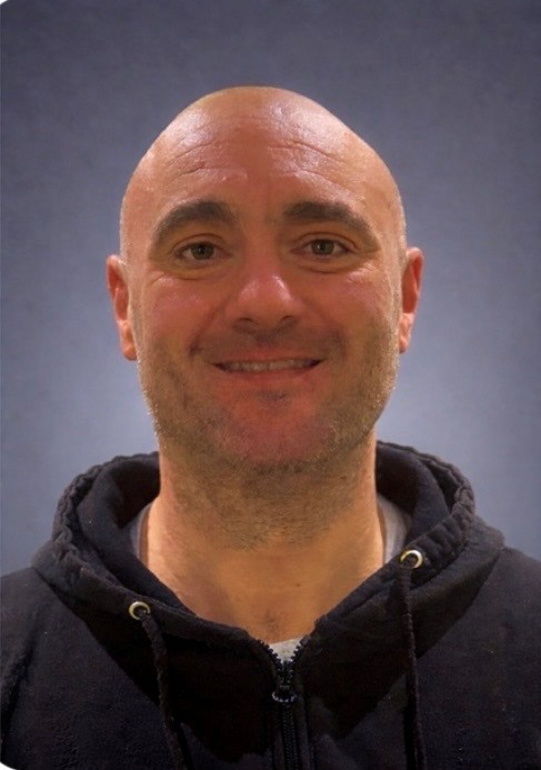 Business Portrait of Mark in a black zip hoodie