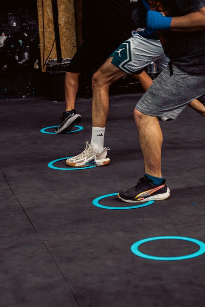 Intense boxing footwork drill at a gym in Buenos Aires, showcasing agility and precision.